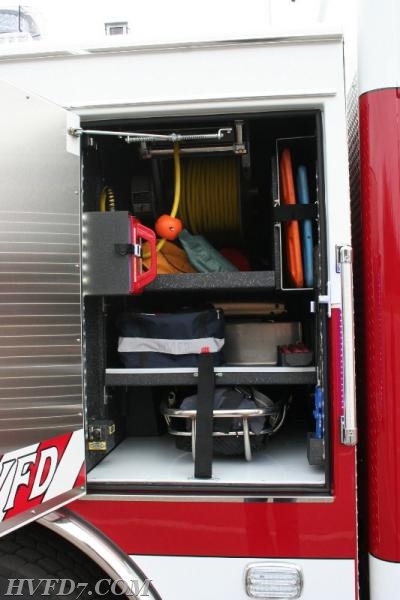 Drivers side Cab transverse compartment has 200' cord reel, SKED, LSP Backboard, KED, backboards, traffic cones and flares, bolt cutters, and stokes basket with all RIT equipment.  The stokes basket can be retrieved from either side.